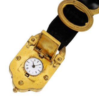 Gold-plated fob watch in the shape of a curtain lock Circa 1820