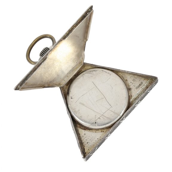 Swiss triangular form watch with Masonic motifs Circa 1935 Swiss triangular form watch with Masonic motifs Circa 1935