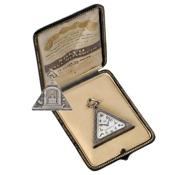 Swiss silver triangular watch with Masonic motifs Circa 1900 Swiss silver triangular watch with Masonic motifs Circa 1900