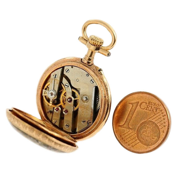Swiss miniature watch with corresponding watch chain Circa 1890 Swiss miniature watch with corresponding watch chain Circa 1890