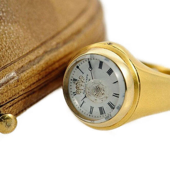 Swiss heavy signet ring set with a miniature watch Circa 1860 Swiss heavy signet ring set with a miniature watch Circa 1860