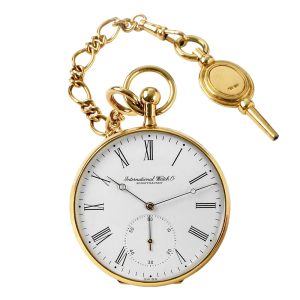 Swiss gold lever watch with chain, key and pouch Circa 1975