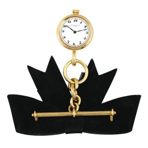 Swiss lapel quartz watch with chain and brooch Circa 1989