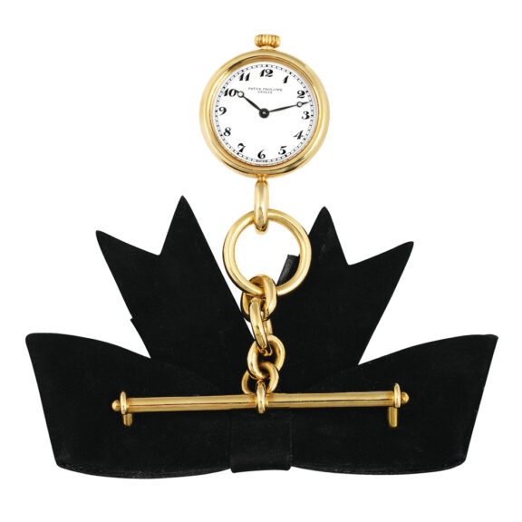 Swiss lapel quartz watch with chain and brooch Circa 1989