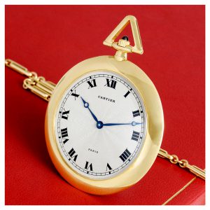 French gold lever with 18 Carat gold Cartier long chain Circa 1985