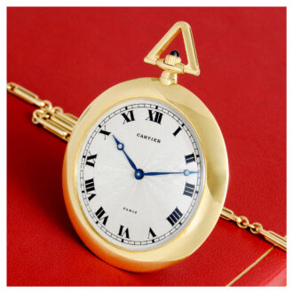French gold lever with 18 Carat gold Cartier long chain Circa 1985