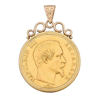 A pendant watch within an 1858 50 Franc French coin Circa 1950