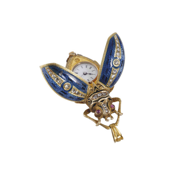 Swiss gold, enamel, diamond, ruby set form watch Circa 1890