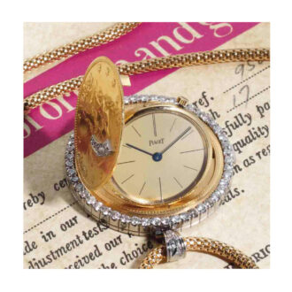 Swiss gold, platinum and diamond set coin watch Circa 1970