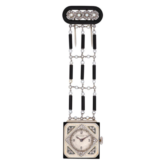 Platinum, gold, onyx, diamond set pendant watch Circa 1930