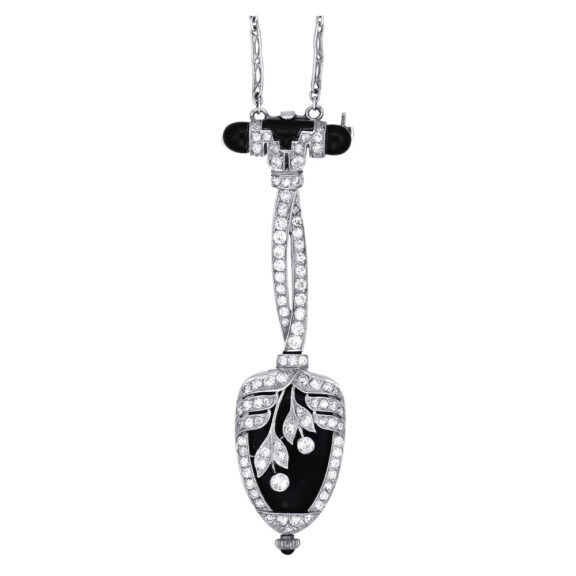 A fine and rare Swiss platinum, enamel and diamond set Art Deco keyless lever swiveling pendant watch with chain, circa 1925 A fine and rare Swiss platinum, enamel and diamond set Art Deco keyless lever swiveling pendant watch with chain, circa 1925