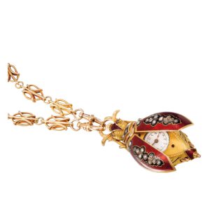 Swiss 18K gold cylinder scarab form pendant watch Circa 1910