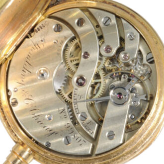 Small Swiss 14K gold open faced repoussé watch Circa 1893