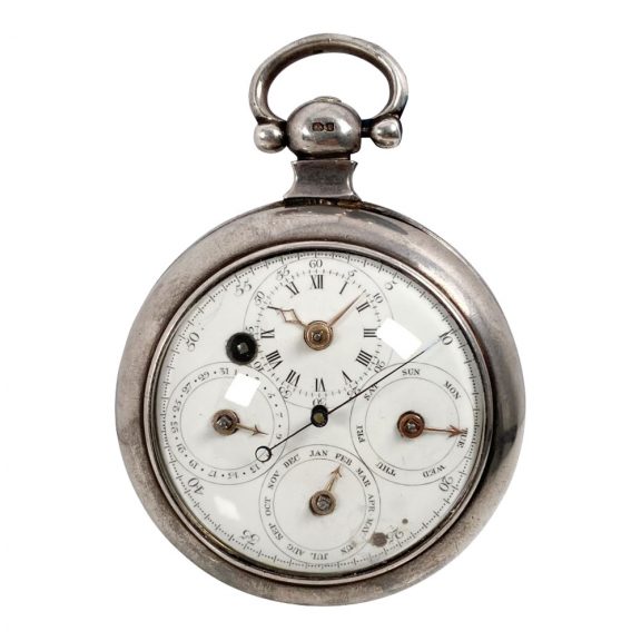 White enamel regulator dials on both sides, the one on the front features four subsidiary dials for displaying the time, the days of the week, the months and the date, the central seconds hand can be stopped with a lever on the side of the case, the back shows five subsidiary dials which display minutes, hours, moon ages, the tide and regulation, an arched aperture in the center reveals a digital retrograde second.