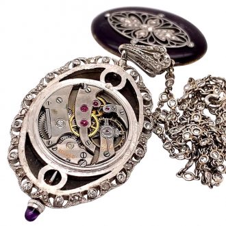Swiss oval belle époque pendant watch with chain Circa 1910 Swiss oval belle époque pendant watch with chain Circa 1910