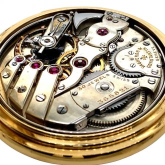 Swiss 18K gold open faced lever watch with alarm Circa 1921 Swiss 18K gold open faced lever watch with alarm Circa 1921