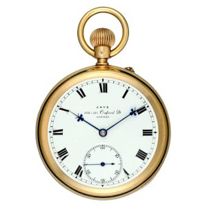 An English lever pocket watch in a gold open face case Circa 1906