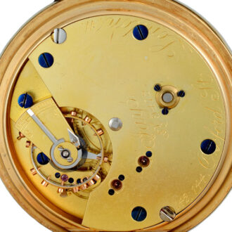 An English lever pocket watch in a gold open face case Circa 1906