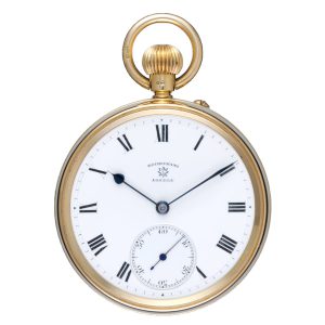 English lever pocket watch in a gold open face case Circa 1920