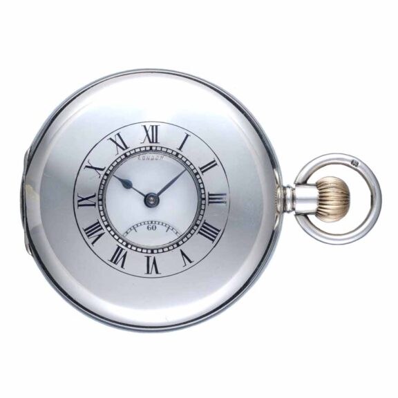 A Swiss lever pocket watch in a silver half hunter case Circa 1935 A Swiss lever pocket watch in a silver half hunter case Circa 1935