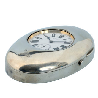 A Swiss nickle eight day lever fitted in a silver oval case Circa 1913