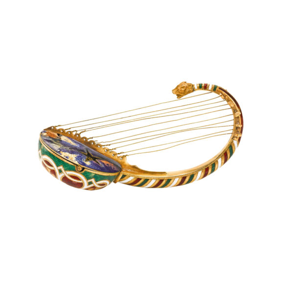 Austrian gold, enamel Egyptian harp form watch Circa 1850 Austrian gold, enamel Egyptian harp form watch Circa 1850