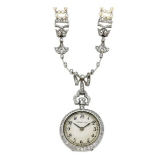 Swiss platinum, diamond/pearl set pendant watch Circa 1910