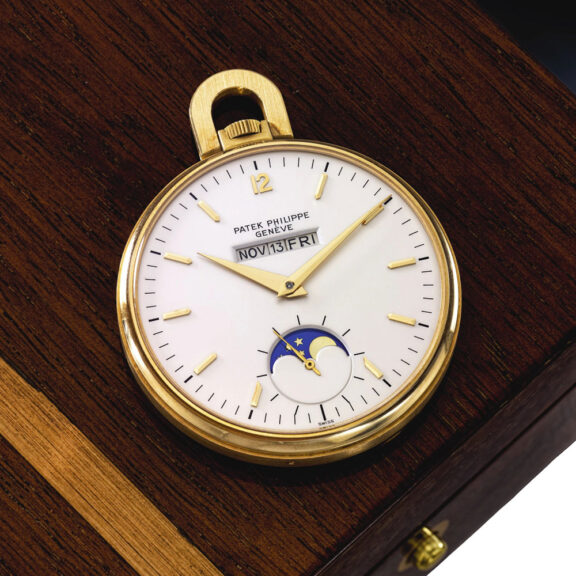 Swiss 18K gold lever with linear calendar and moon phases Circa 1981