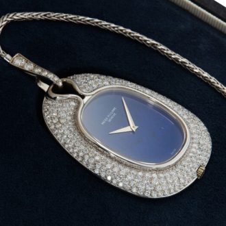 Swiss 18K white gold and diamond set watch with chain Circa 1976