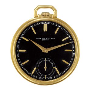 Swiss 18K yellow gold keyless dress watch with a black dial Circa 1940