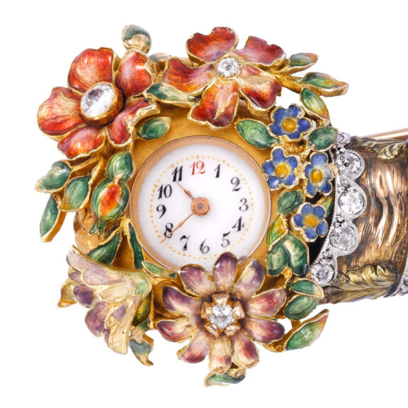 Swiss 18k gold brooch watch in the form of a cornucopia Circa 1910 Swiss 18k gold brooch watch in the form of a cornucopia Circa 1910