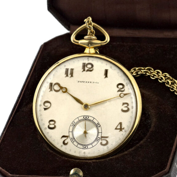 Swiss 14K gold watch accompanied by chain and knife Circa 1930 Swiss 14K gold watch accompanied by chain and knife Circa 1930