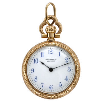 American 18K gold and enamel watch with repousse relief Circa 1900