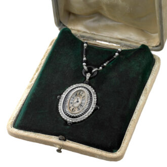 Swiss 18K white gold tonneau-shaped pendant watch Circa 1920
