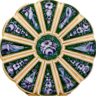 A very fine Swiss 18K gold and painted-on enamel pocket watch, circa 1820. Accompanied by a fitted wooden box. made for the Turkish market. A lobed case with twelve segments decorated with en grisaille painted on enamel flowers and trophies on a translucent red guilloche enamel ground, the bezel decorated to match, pendant and bow with pale green and white champleve enamel decoration. White enamel dial with radial Roman numerals, outer minute track and gold fancy hands. A rhodium-plated movement, 15 jewels, lateral lever escapement, notched bimetallic compensation balance, flat balance spring, and an index regulator.
