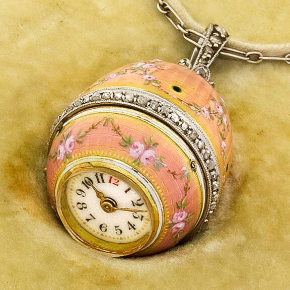 Elegant Swiss gold egg-form watch with long chain Circa 1910