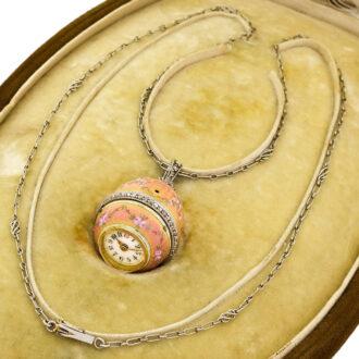 Elegant Swiss gold egg-form watch with long chain Circa 1910