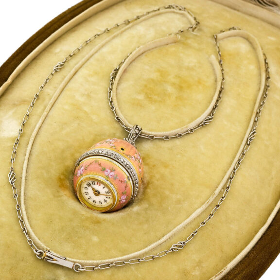 Elegant Swiss gold egg-form watch with long chain Circa 1910 Elegant Swiss gold egg-form watch with long chain Circa 1910
