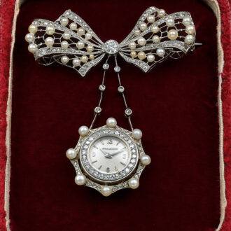 Elegant Swiss white gold, diamond and pearl lapel watch Circa 1960