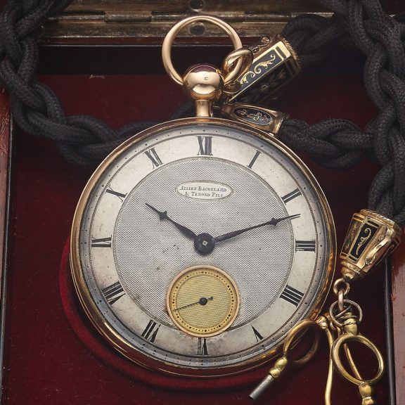 Swiss gold watch with black robe chain and charms Circa 1860