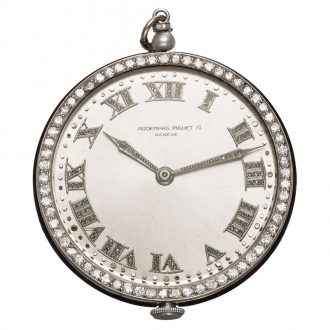 Charming Swiss platinum watch with long chain Circa 1920