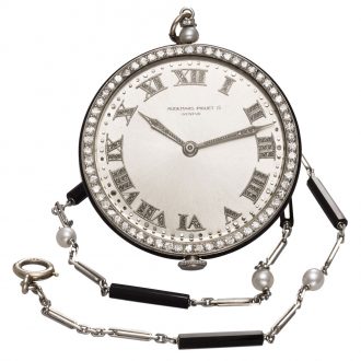Charming Swiss platinum watch with long chain Circa 1920