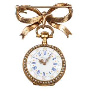 Elegant Swiss gold and pearl lapel brooch watch Circa 1894