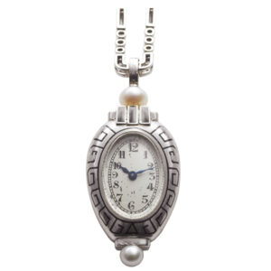 Swiss platinum Amphora-shaped Art Deco lapel watch Circa 1927