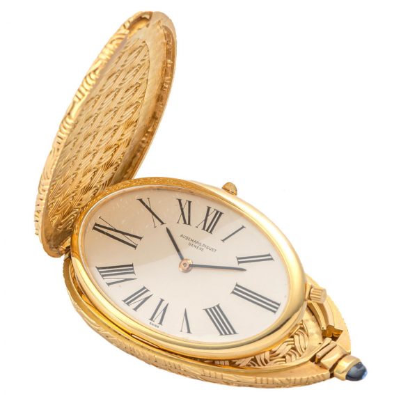 Unusual Swiss 18K gold pebble shaped purse watch Circa 1980