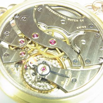 Swiss 18 carat gold open faced lever watch with chain Circa 1915