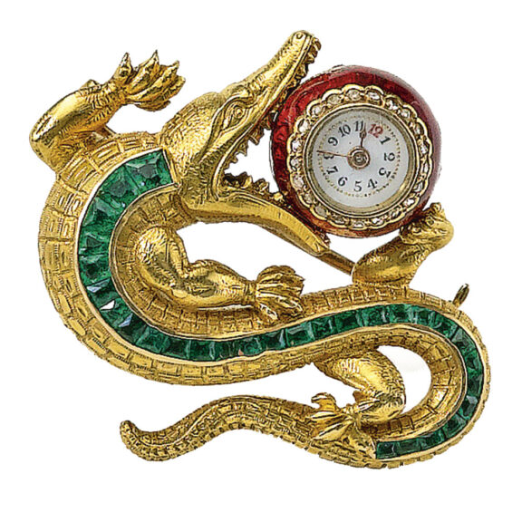 A Swiss emerald set crocodile brooch with watch Circa 1890